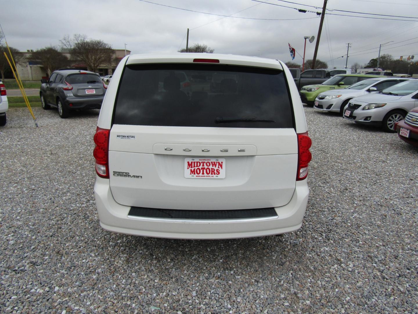 2012 White Dodge Grand Caravan SE (2C4RDGBG5CR) with an 3.6L V6 DOHC 24V engine, Automatic transmission, located at 15016 S Hwy 231, Midland City, AL, 36350, (334) 983-3001, 31.306210, -85.495277 - Photo#7